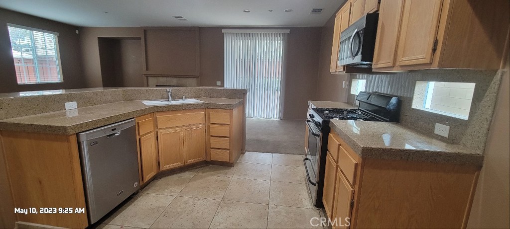11305 Riverleaf Drive Riverside, CA 92505 - Photo 6 of 22 a kitchen with a sink stove and cabinets