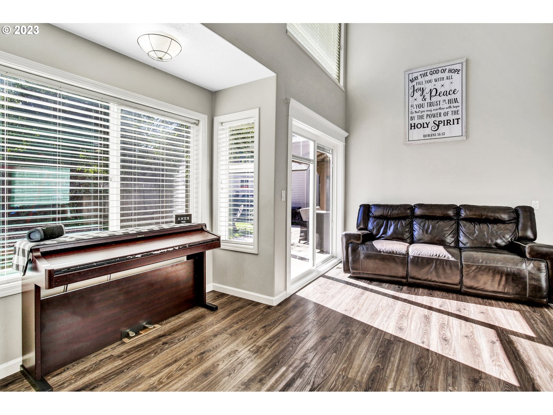 16128 Southeast Rural Court Portland, OR 97236 - Photo 14 of 37 a living room with furniture and a wooden floor
