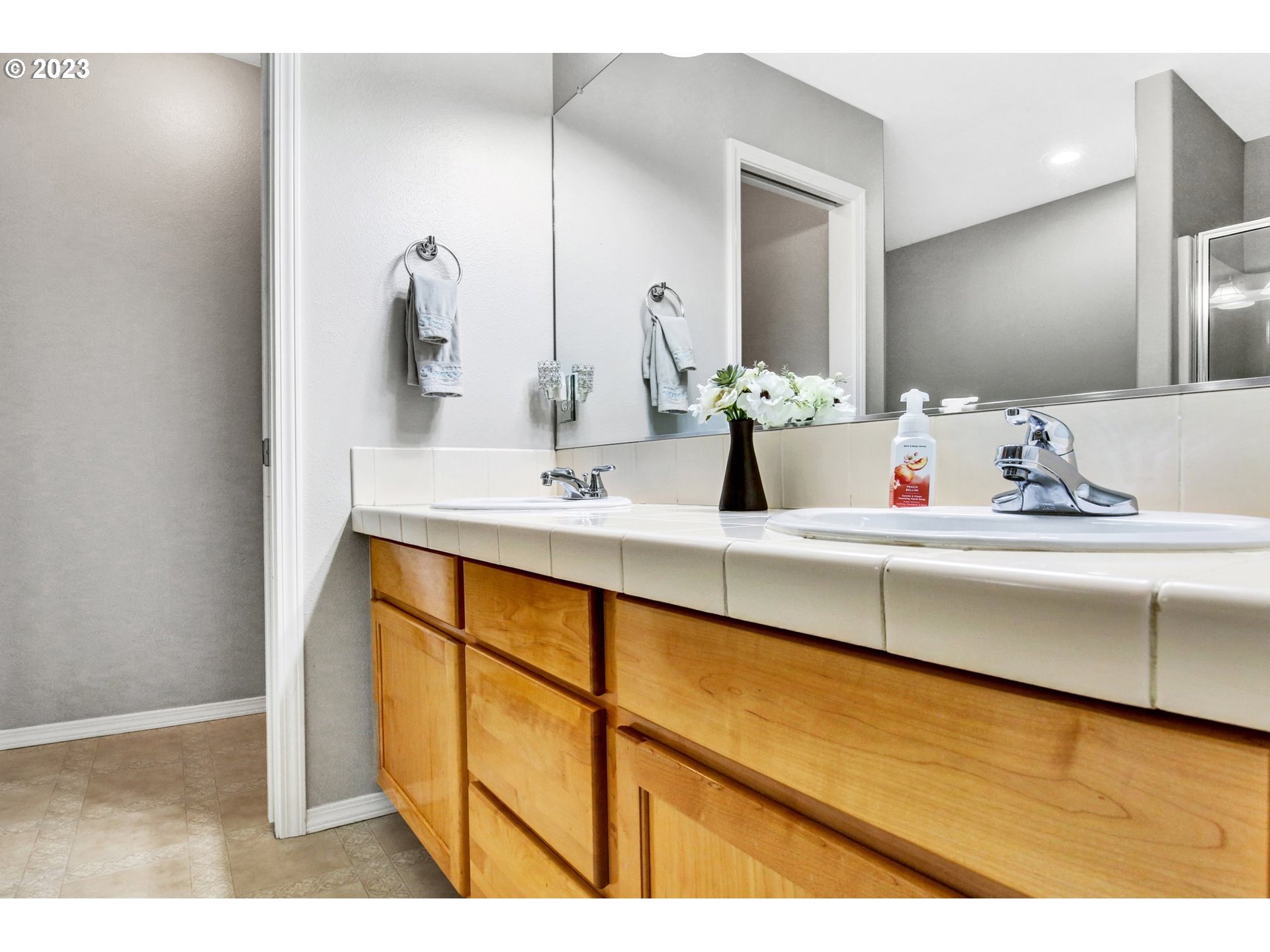 16128 Southeast Rural Court Portland, OR 97236 - Photo 20 of 37 a bathroom with a sink and a mirror