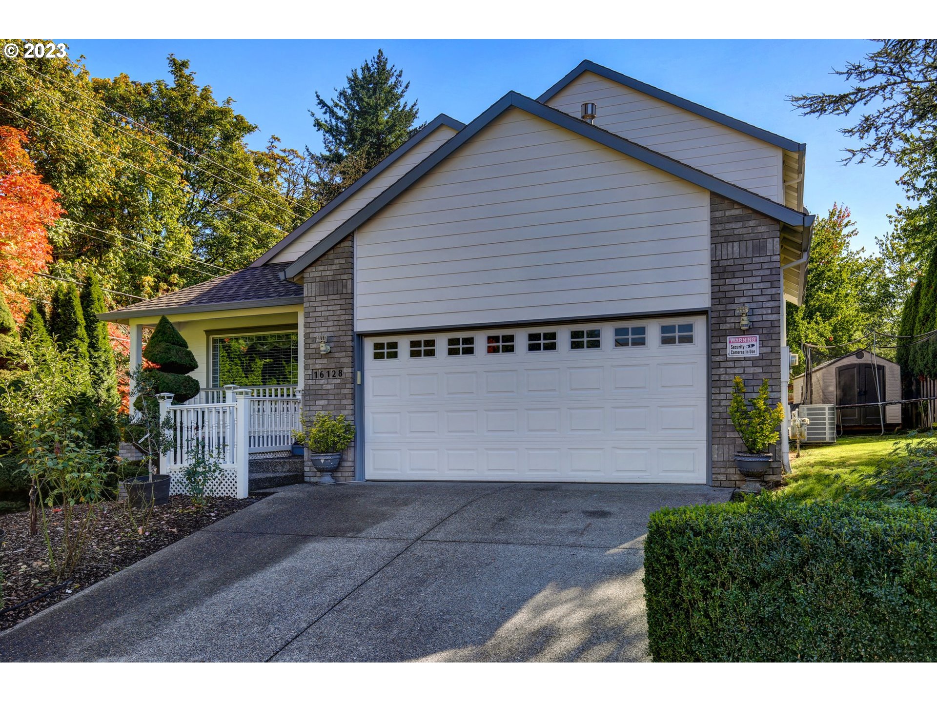 16128 Southeast Rural Court Portland, OR 97236 - Photo 2 of 37 a front view of a house with garden