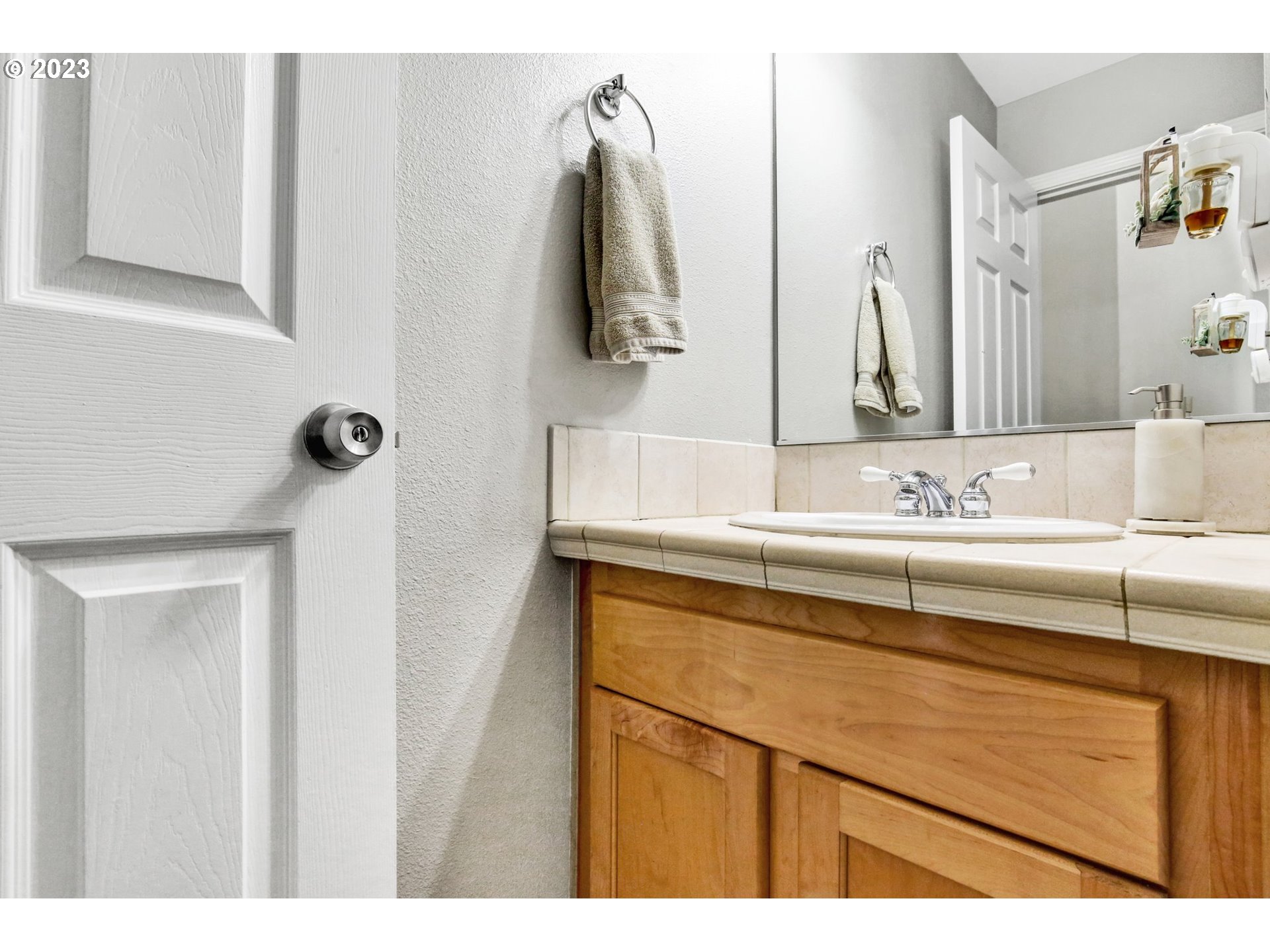 16128 Southeast Rural Court Portland, OR 97236 - Photo 23 of 37 a bathroom with a sink and a mirror