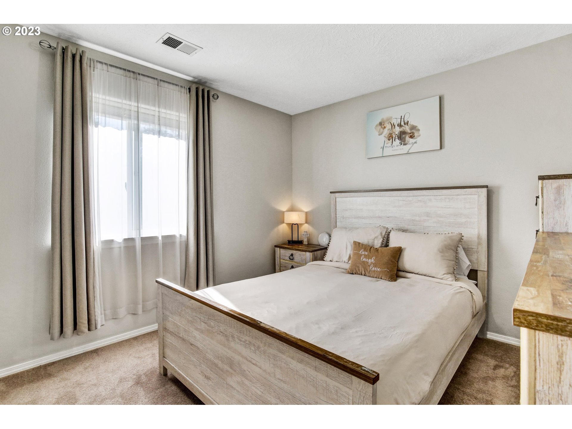 16128 Southeast Rural Court Portland, OR 97236 - Photo 25 of 37 a bedroom with a bed and a large window