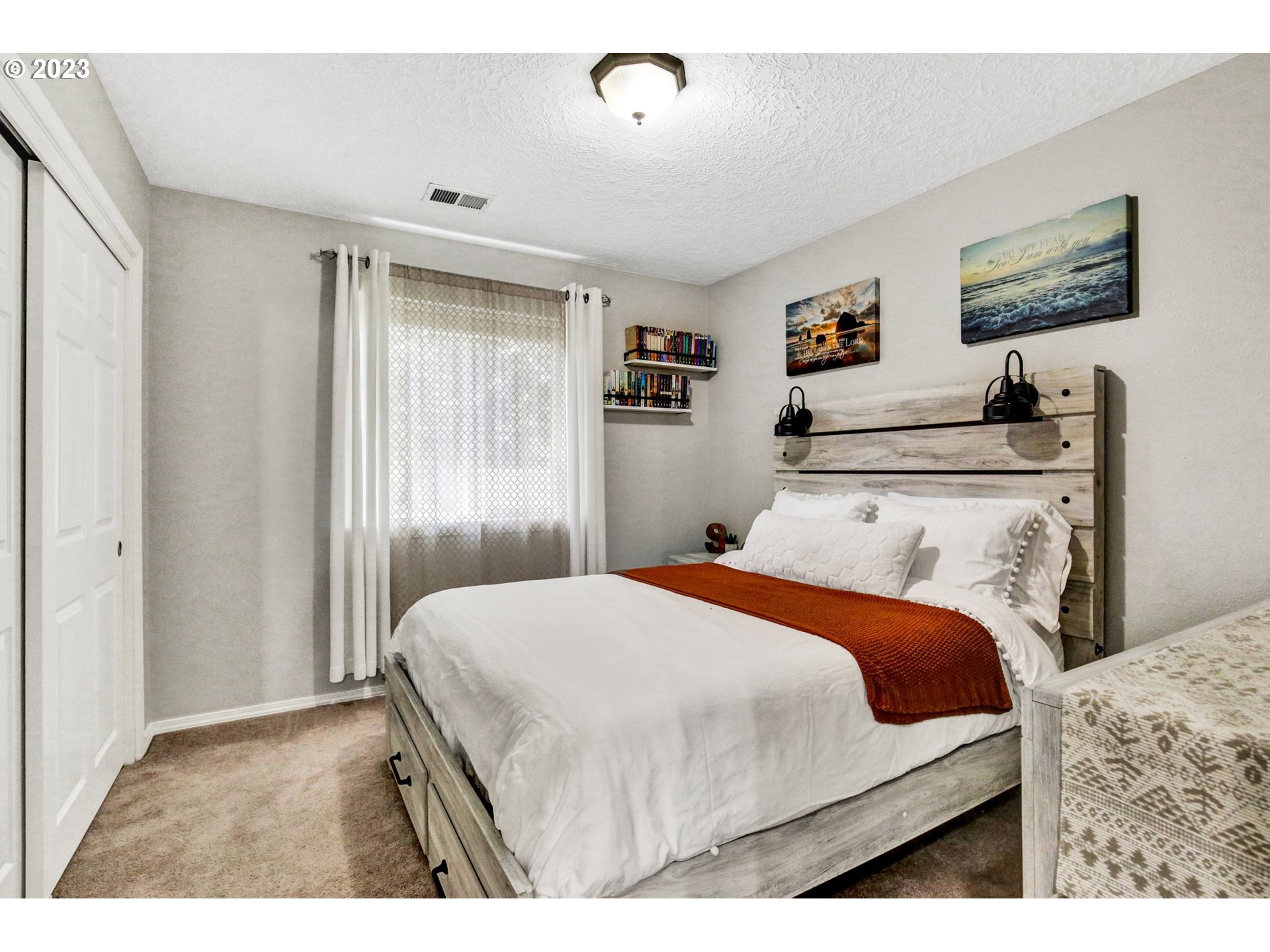 16128 Southeast Rural Court Portland, OR 97236 - Photo 27 of 37 a bedroom with a bed and a dresser