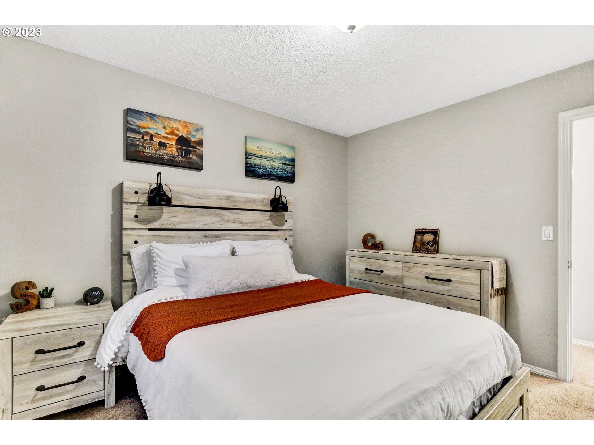 16128 Southeast Rural Court Portland, OR 97236 - Photo 28 of 37 a bedroom with a bed and a dresser
