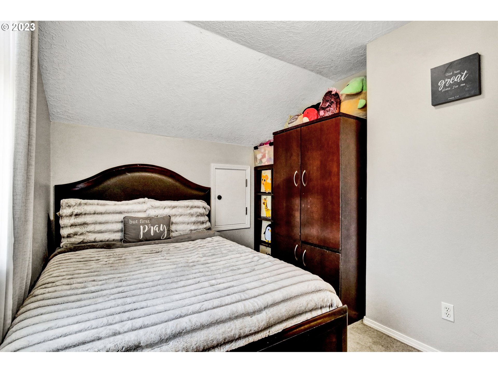 16128 Southeast Rural Court Portland, OR 97236 - Photo 30 of 37 a bedroom with a bed and a painting on the wall