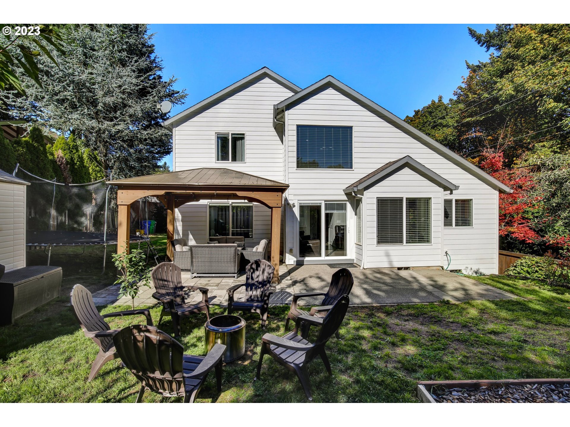 16128 Southeast Rural Court Portland, OR 97236 - Photo 33 of 37 a view of house with yard and sitting area