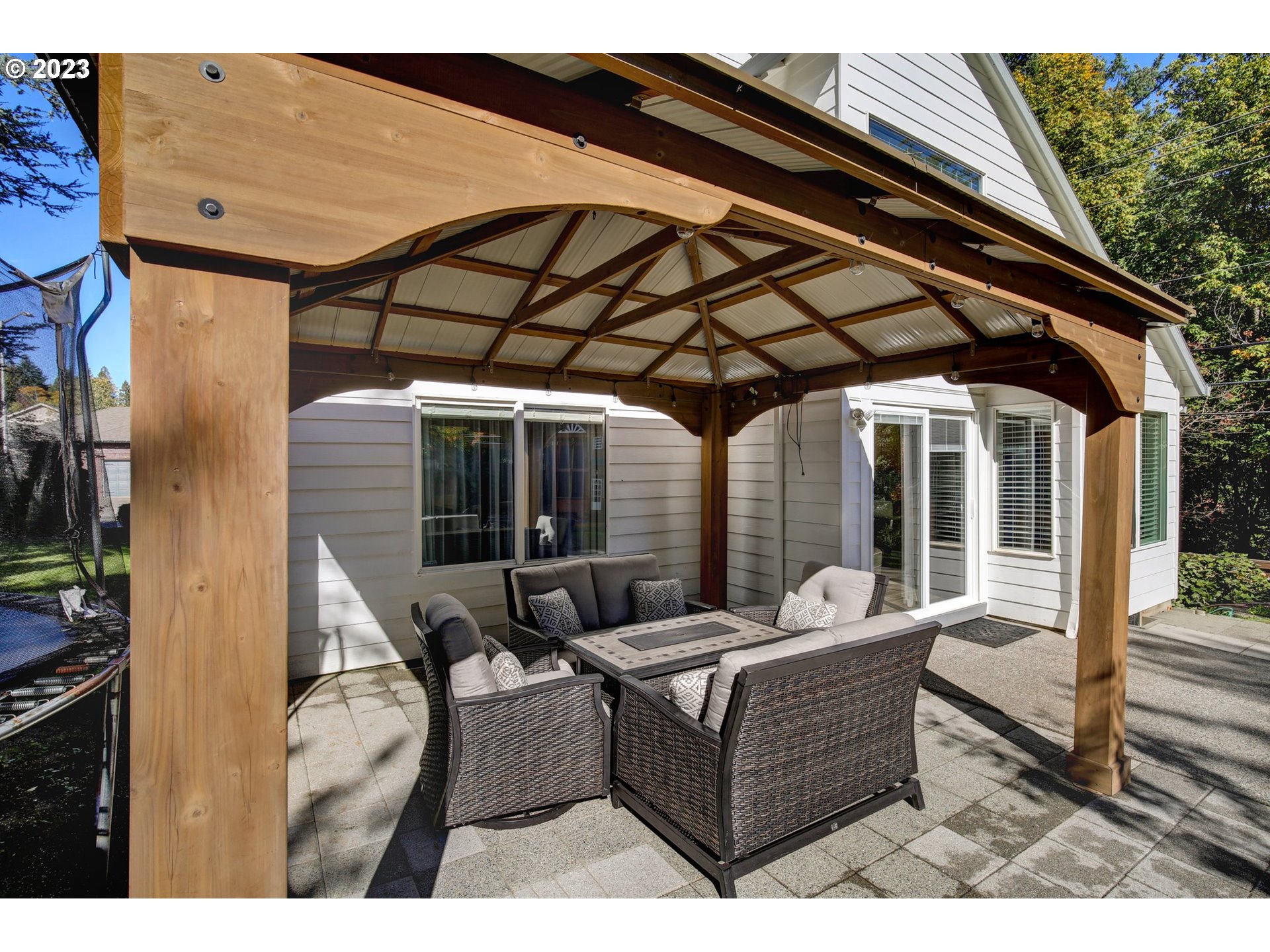 16128 Southeast Rural Court Portland, OR 97236 - Photo 34 of 37 a patio with patio couch and wooden floor