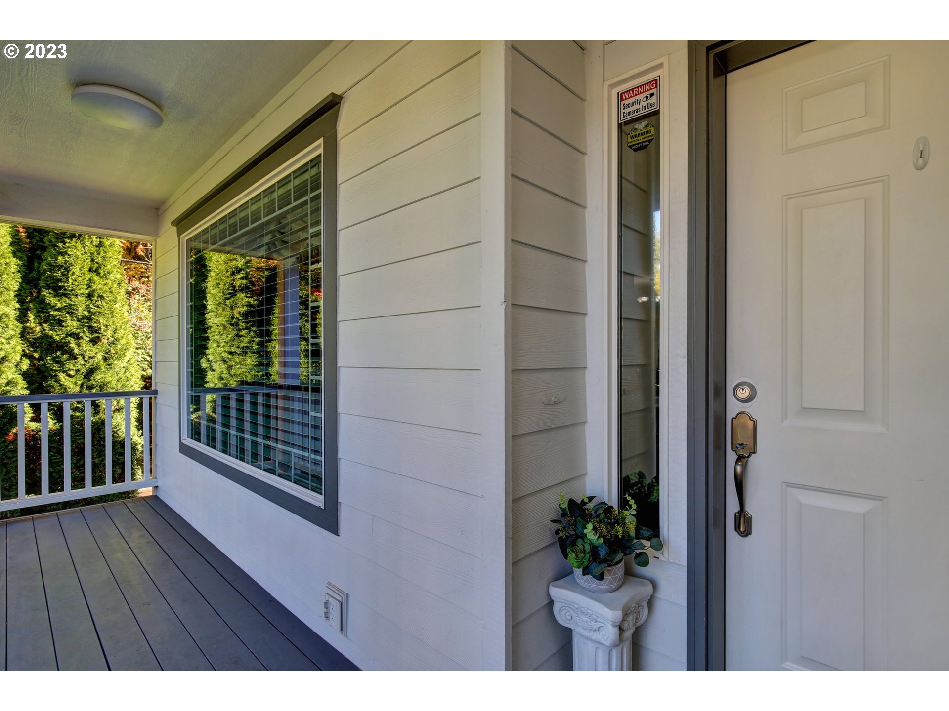 16128 Southeast Rural Court Portland, OR 97236 - Photo 4 of 37 a view of balcony with wooden floor