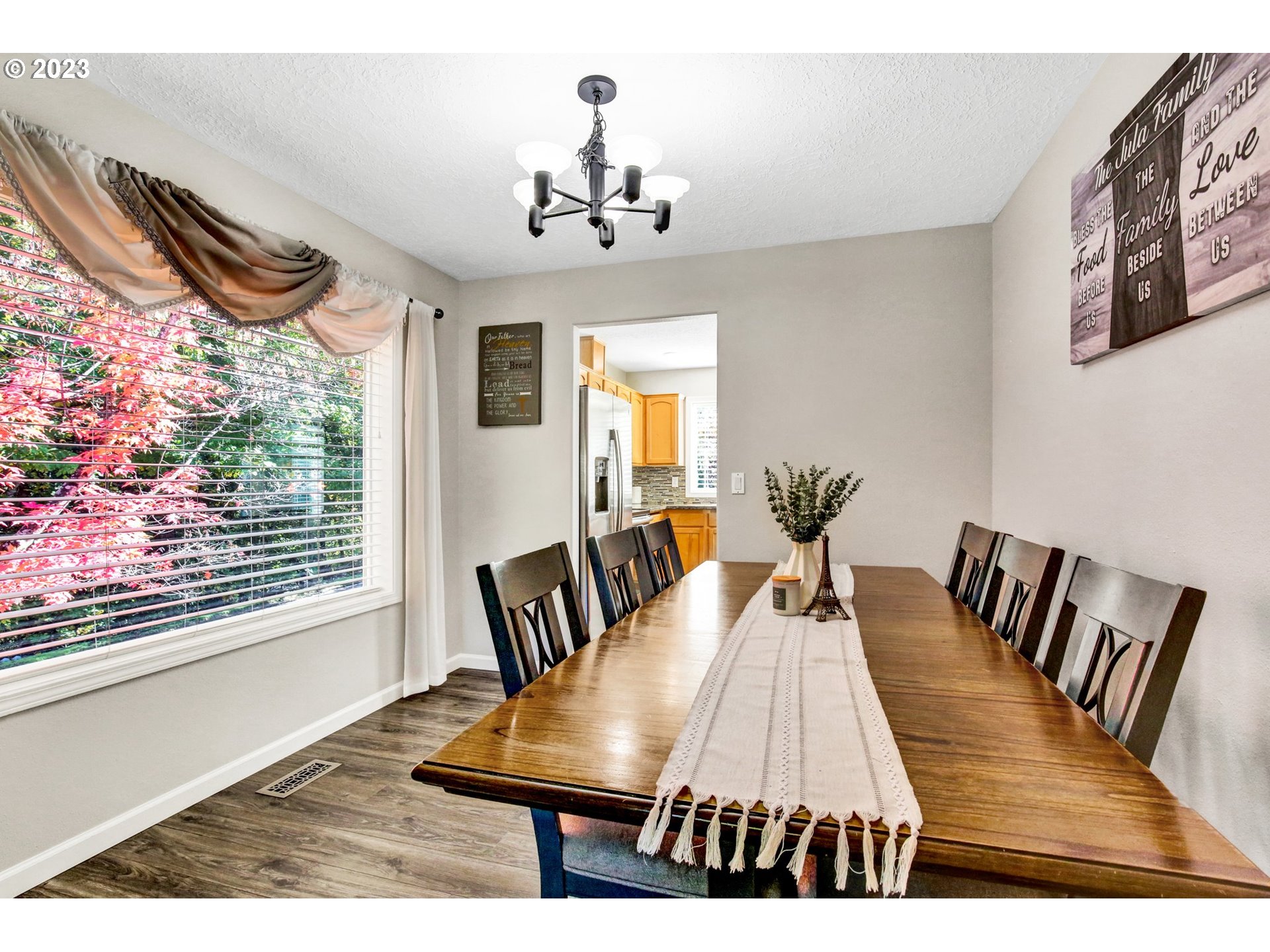 16128 Southeast Rural Court Portland, OR 97236 - Photo 8 of 37 a view of a dining room with furniture and wooden floor