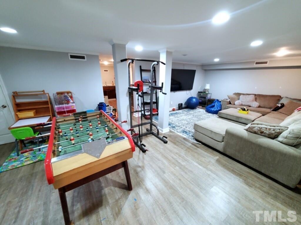 800 Lake Boone Trail Raleigh, NC 27607 - Photo 3 of 4 a living room filled with furniture and a flat screen tv