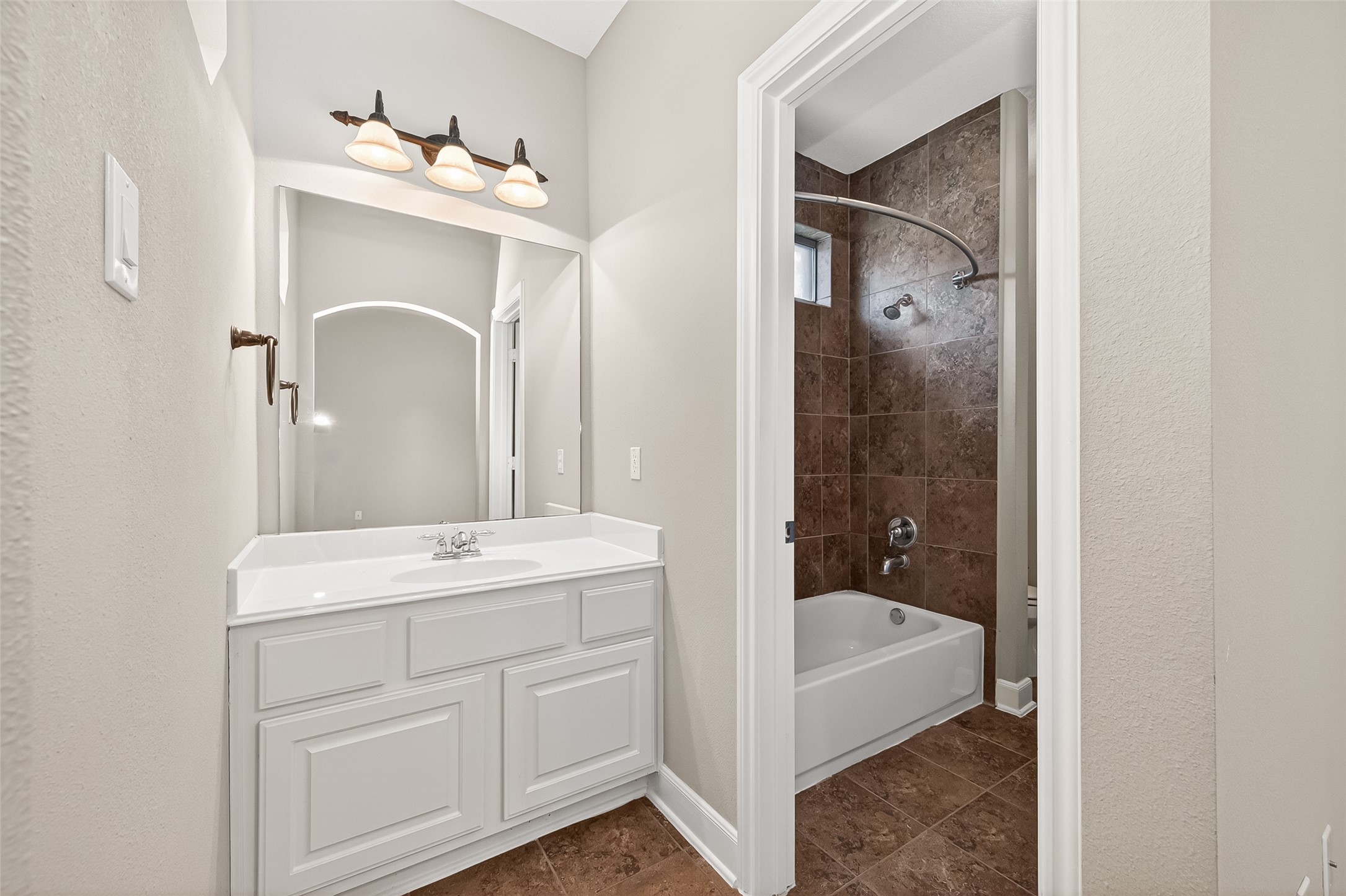 2310 Spring Lake Park Lane Spring, TX 77386 - Photo 27 of 47 a bathroom with a tub a sink and mirror