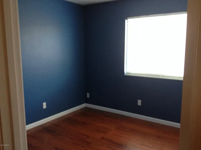 a view of an empty room and window