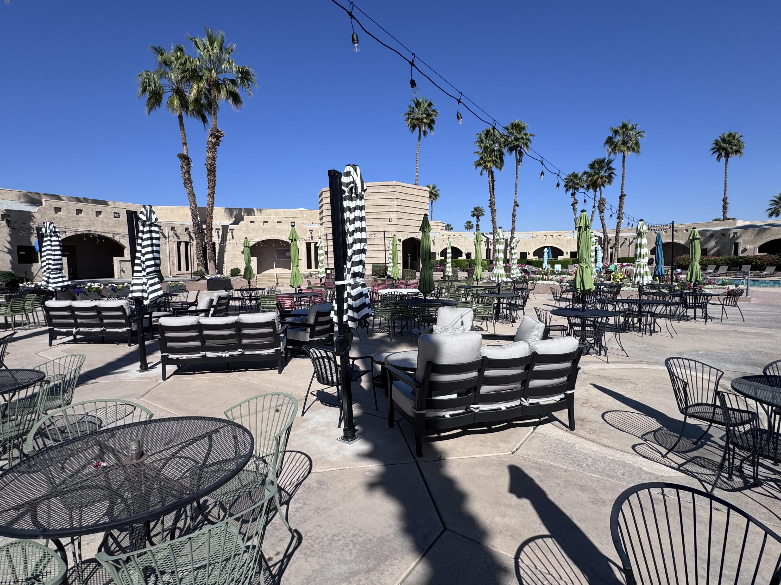 81620 Ave 49, Unit 160B Indio, CA 92201 - Photo 17 of 18 a view of a terrace with seating area and furniture