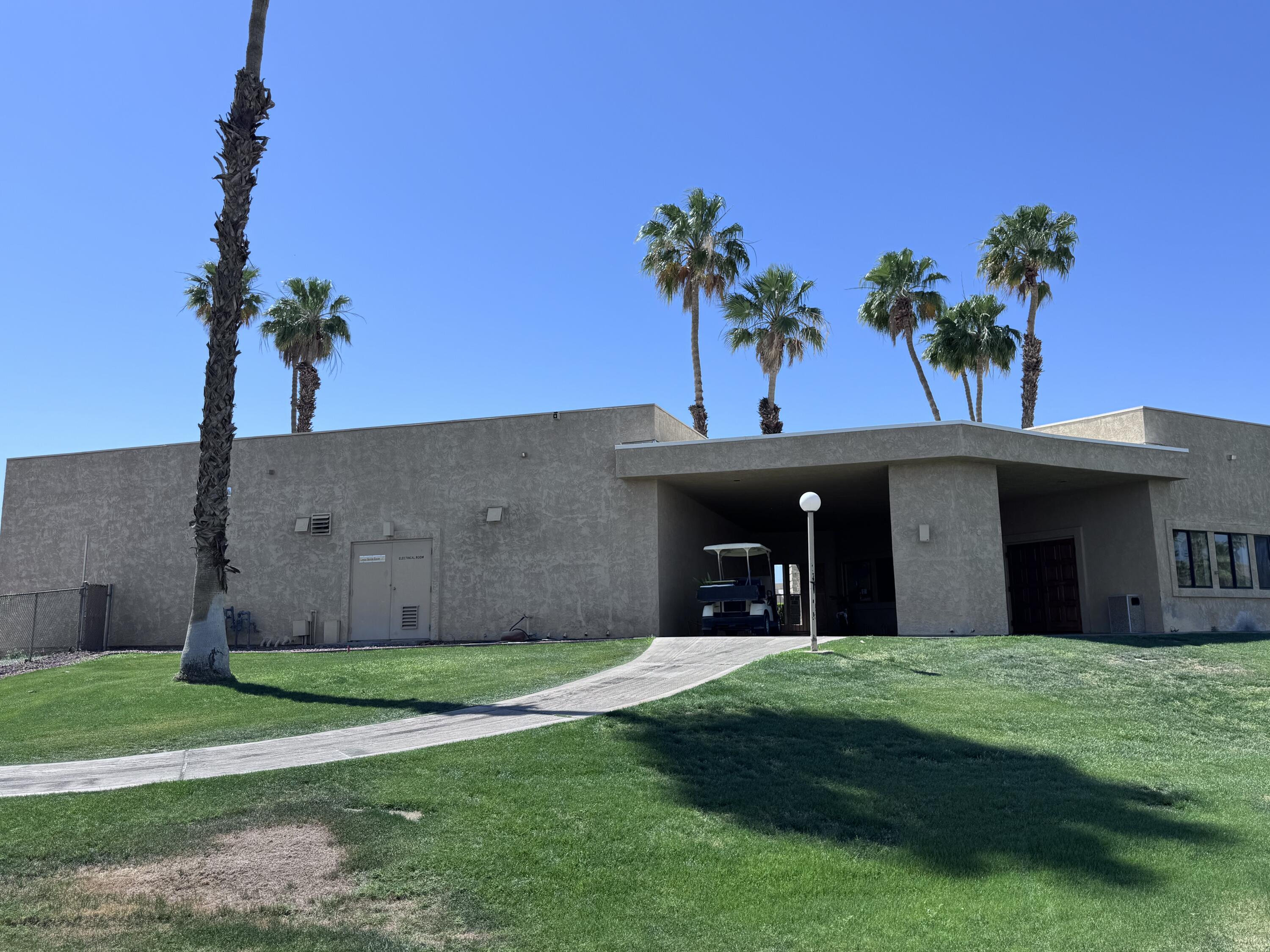 81620 Ave 49, Unit 160B Indio, CA 92201 - Photo 10 of 18 a front view of a house with a garden