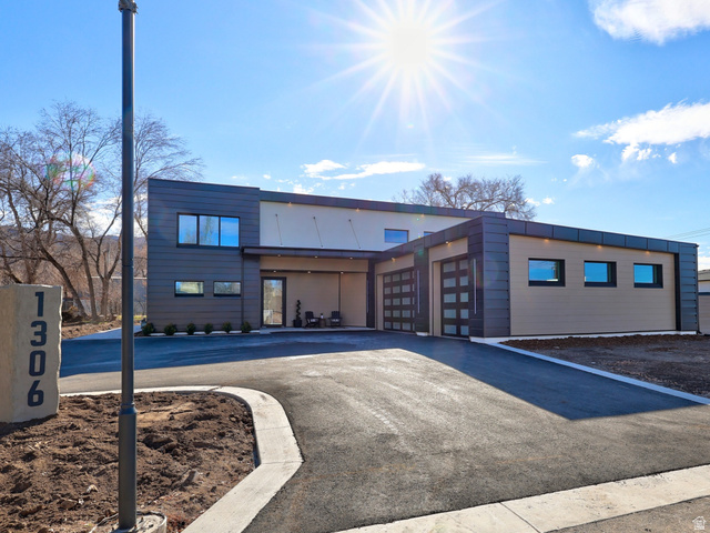 1306 East Victor Lane Draper, UT 84020 - Photo 1 of 60 View of building exterior with an attached garage and driveway