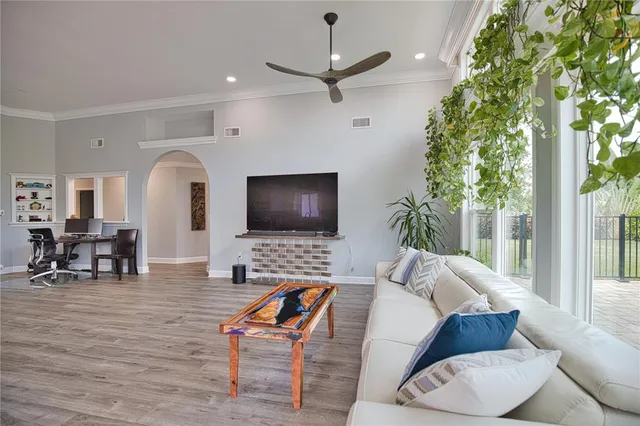 a living room with furniture and a flat screen tv
