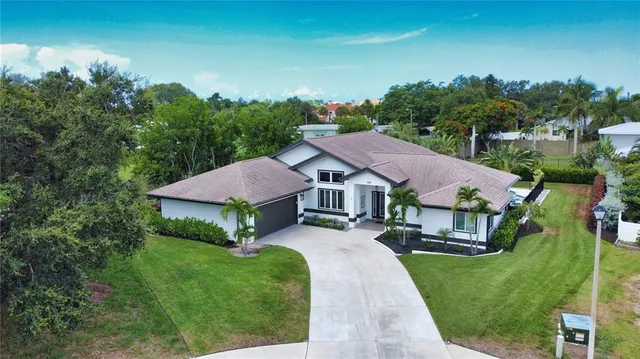 an aerial view of a house and garden