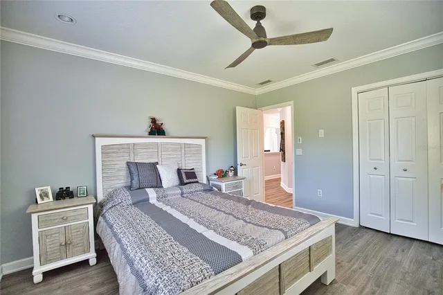 a bedroom with a bed and a dresser