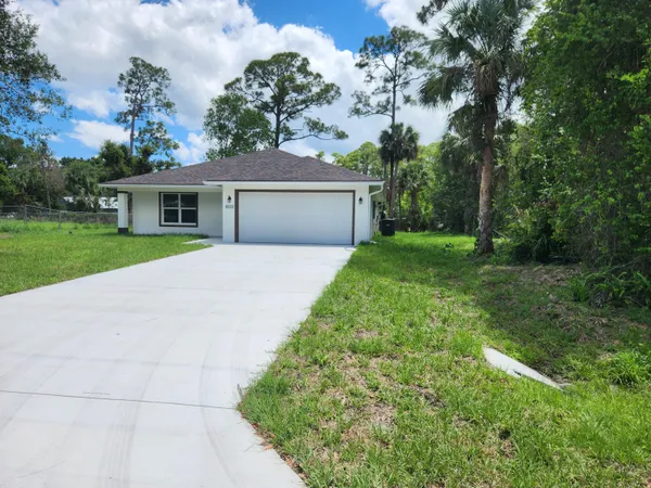 front view of a house with a yard