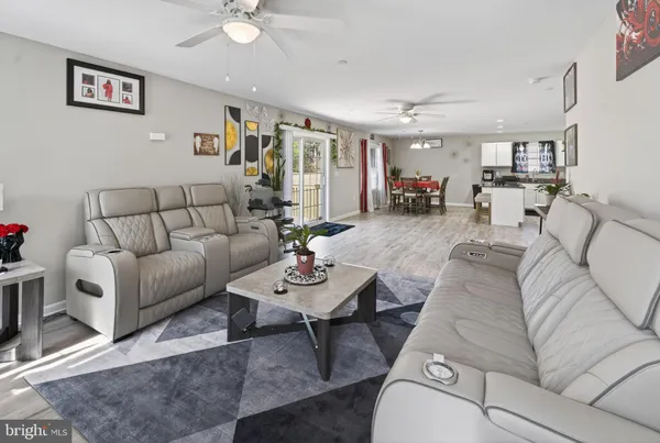 a living room with furniture and a rug