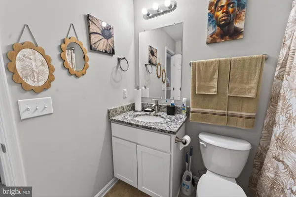 a bathroom with a toilet and a sink
