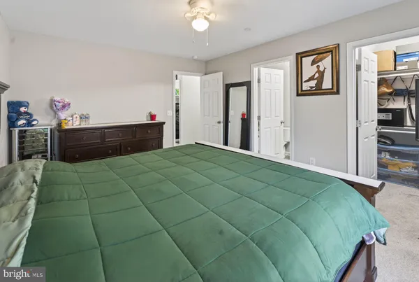 a bedroom with a bed and a cabinets