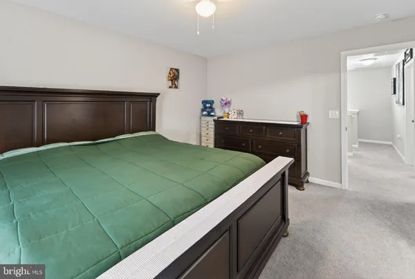 a bedroom with a bed and a cabinets