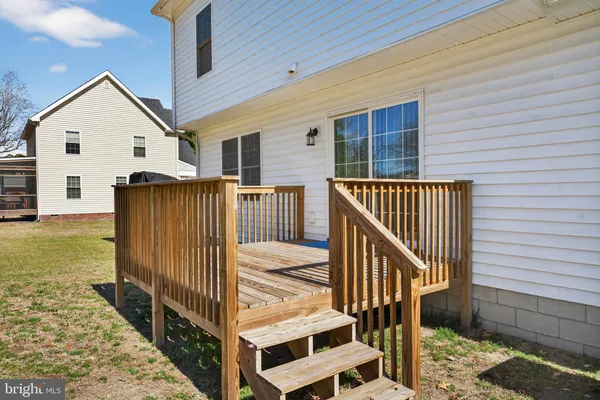 a view of a house with backyard and wooden floor