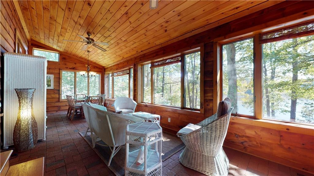 1641 Concord Church Road Roxboro, NC 27574 - Photo 13 of 30 a dining room with furniture large windows and wooden floor