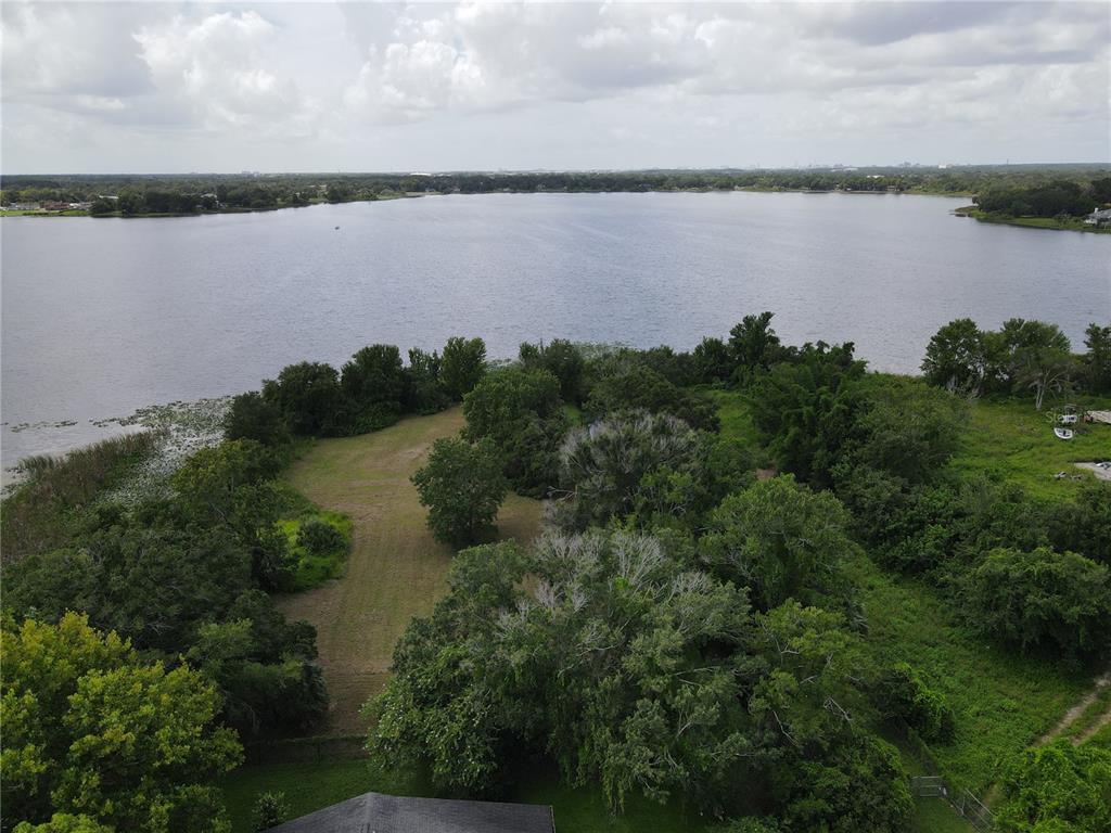 Dobson Street Orlando, FL 32805 - Photo 2 of 2 a view of a lake from a yard