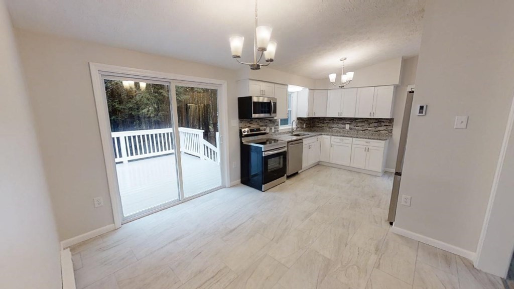 474 Forristall Road Winchendon, MA 01475 - Photo 12 of 29 a open kitchen with white cabinets and stainless steel appliances