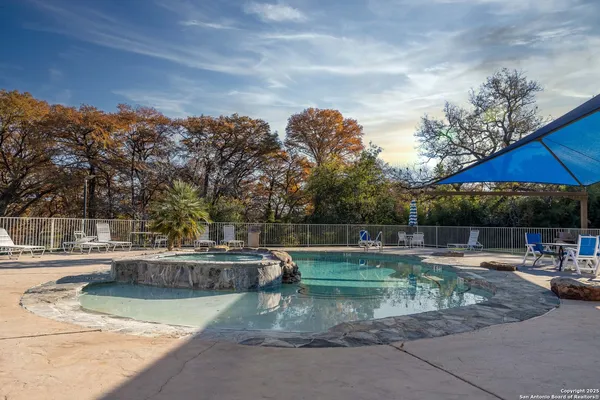 a view of a swimming pool with a patio