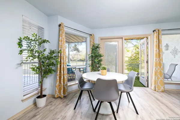a view of a dining room with furniture window and wooden floor