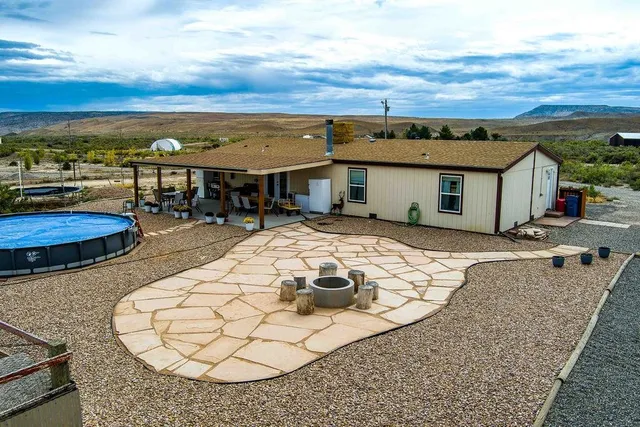an aerial view of a house with outdoor space