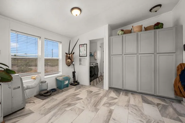 a view of a storage & utility room with a window