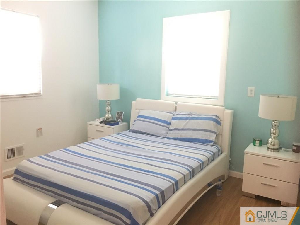 2 Matawan Road Old Bridge, NJ 08879 - Photo 11 of 15 a bedroom with a bed and a table
