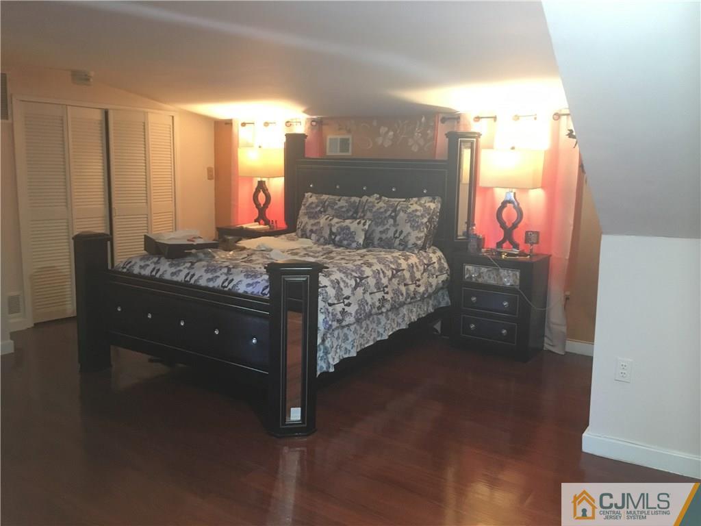 2 Matawan Road Old Bridge, NJ 08879 - Photo 3 of 15 a bed room with a bed and a dresser