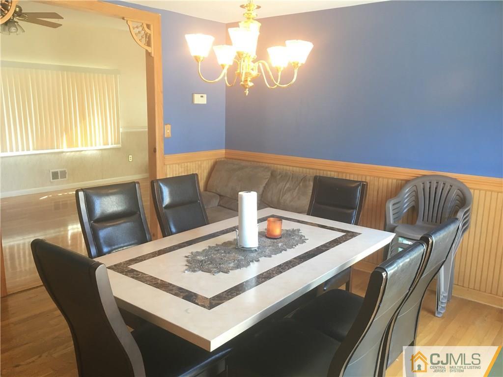 2 Matawan Road Old Bridge, NJ 08879 - Photo 9 of 15 a view of a dining room with furniture and wooden floor
