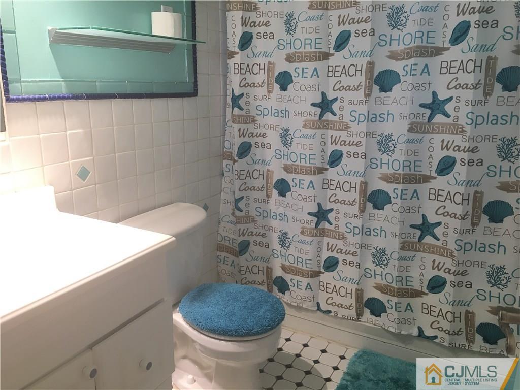 2 Matawan Road Old Bridge, NJ 08879 - Photo 10 of 15 a bathroom with a toilet and a sink