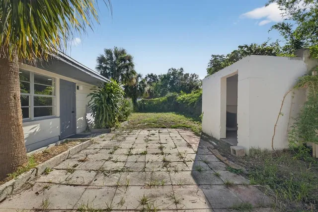 a wooden bench sitting in front of a house
