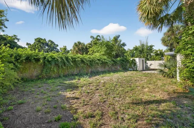 a backyard of a house with lots of green space