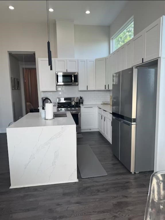 3610 Dreyfus Street, Unit A Houston, TX 77021 - Photo 6 of 20 a kitchen with stainless steel appliances a refrigerator stove microwave and sink