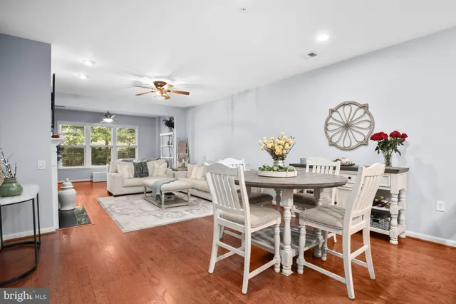 a view of a dining room with furniture window and wooden floor