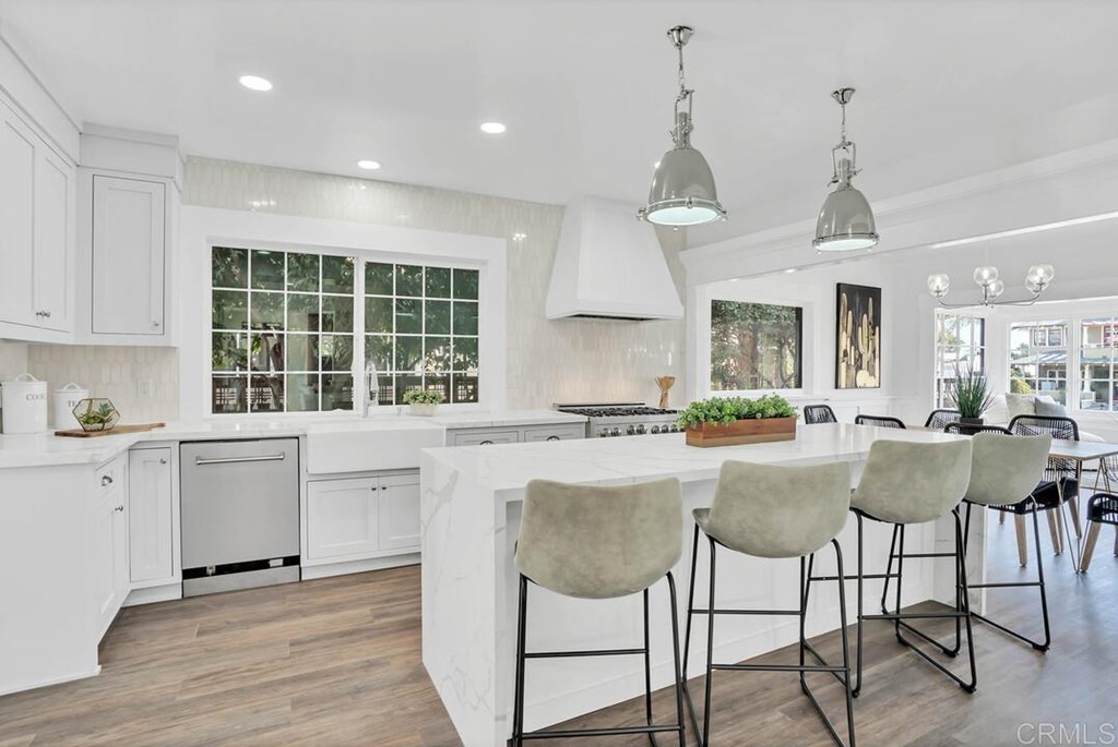 a kitchen with center island and windows