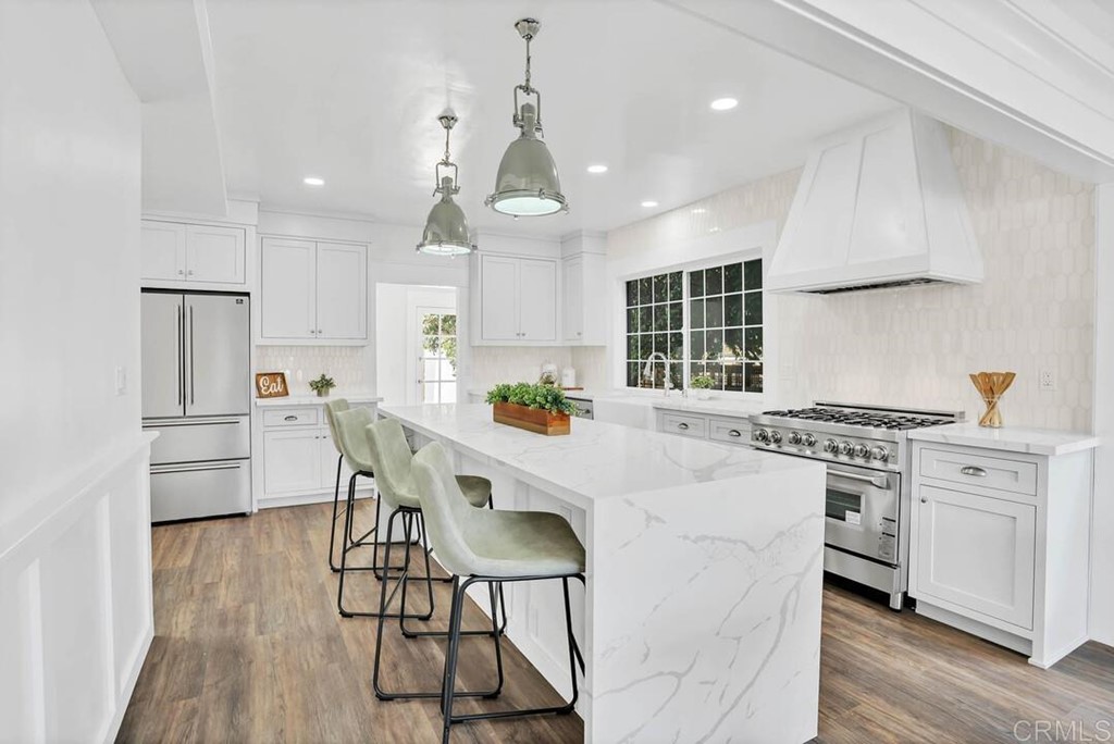1864 Sunset Boulevard San Diego, CA 92103 - Photo 2 of 57 a kitchen with stainless steel appliances a white table chairs refrigerator and sink