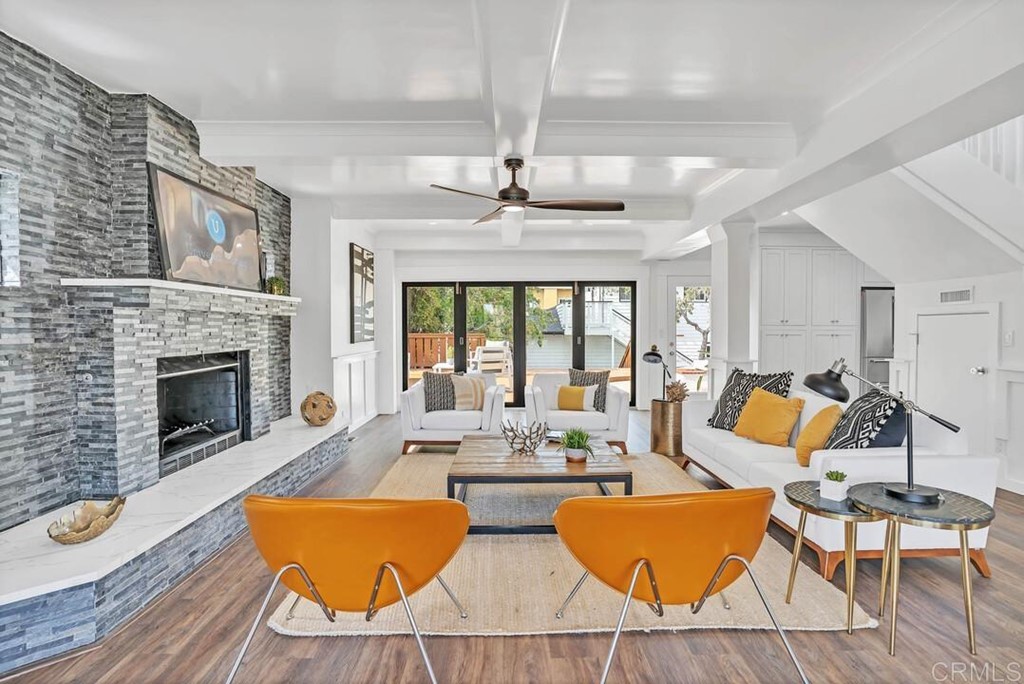 1864 Sunset Boulevard San Diego, CA 92103 - Photo 19 of 57 a living room with furniture kitchen view and a fireplace