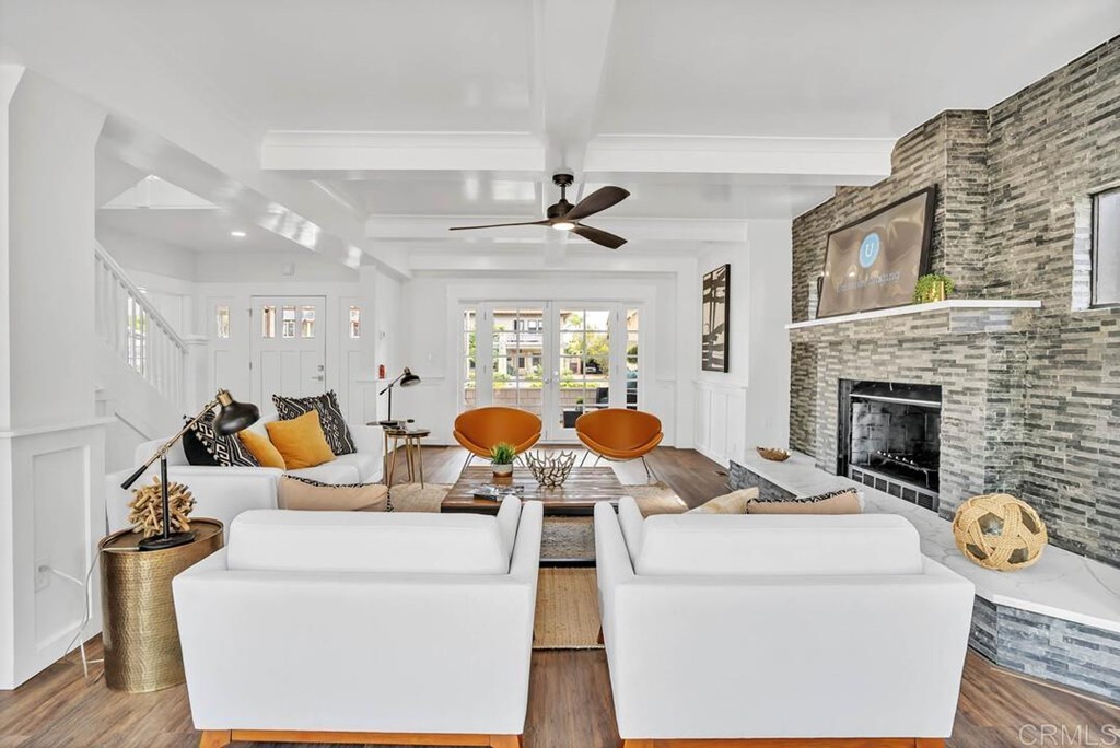 1864 Sunset Boulevard San Diego, CA 92103 - Photo 20 of 57 a living room with furniture a fireplace and a chandelier