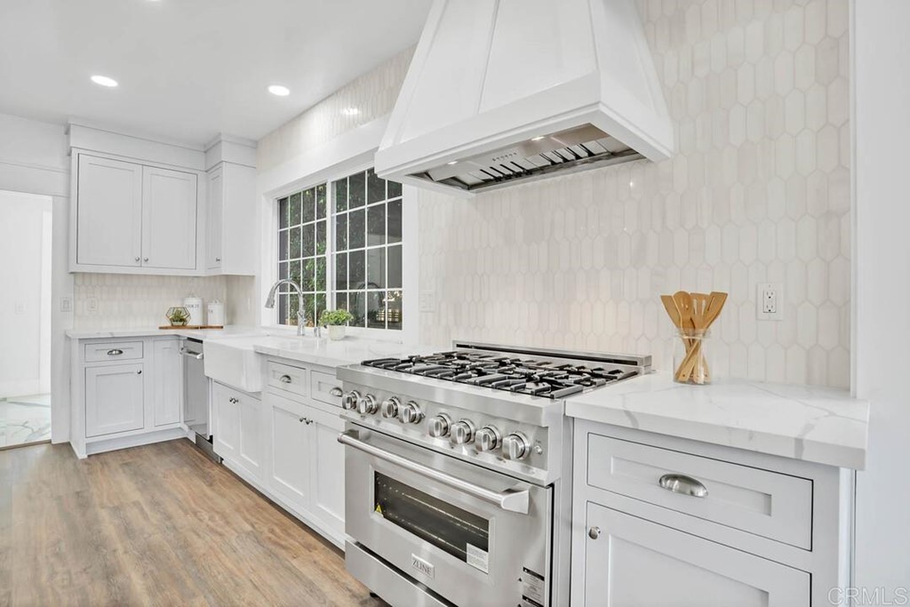 1864 Sunset Boulevard San Diego, CA 92103 - Photo 3 of 57 a kitchen with granite countertop a stove and a sink