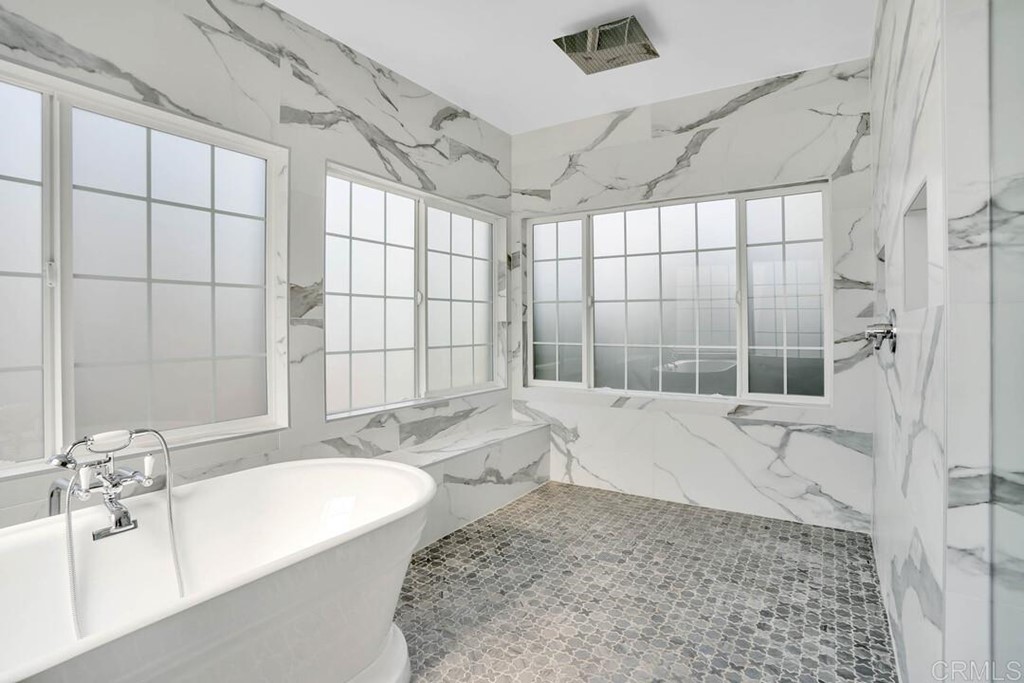 1864 Sunset Boulevard San Diego, CA 92103 - Photo 30 of 57 a bathroom with a granite countertop bathtub sink vanity and shower