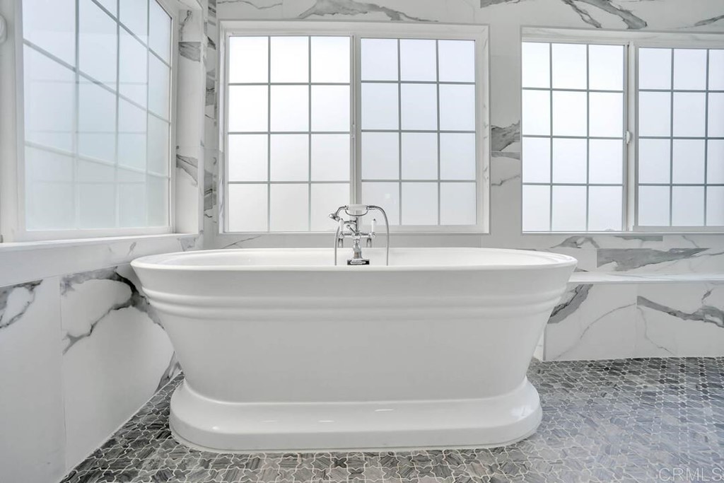 1864 Sunset Boulevard San Diego, CA 92103 - Photo 31 of 57 a white bath tub sitting in a bathroom